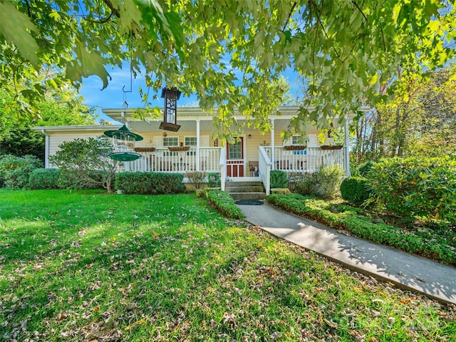 view of front of property with a front yard and covered porch