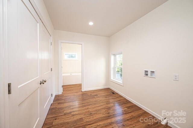 empty room featuring dark hardwood / wood-style flooring