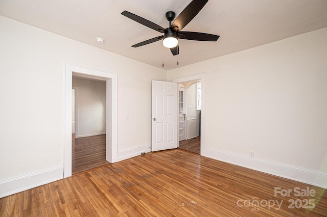 unfurnished bedroom with hardwood / wood-style floors and ceiling fan