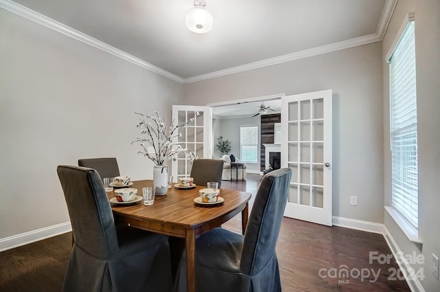 dining area featuring dark wood-type flooring, a healthy amount of sunlight, and french doors