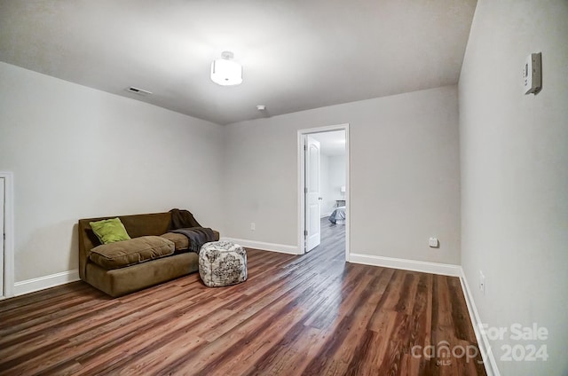 living area with dark wood-type flooring