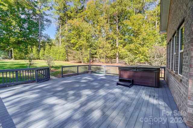 deck with a hot tub