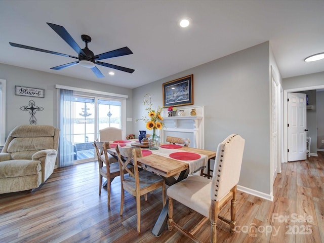 dining area featuring light wood-type flooring, ceiling fan, baseboards, and recessed lighting