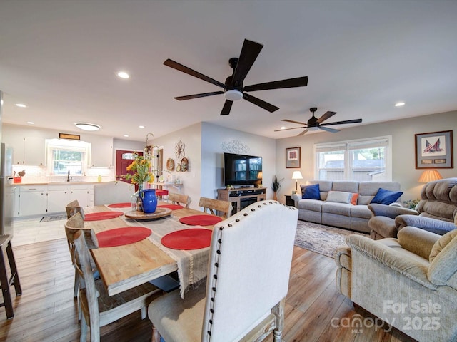 dining area featuring recessed lighting and light wood finished floors