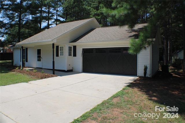 ranch-style house featuring a garage