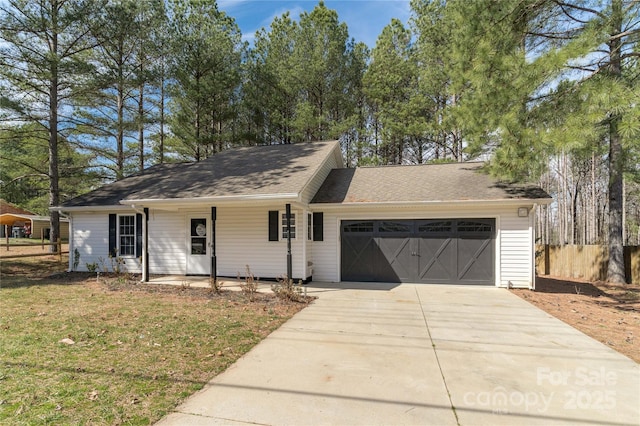 single story home featuring a front lawn and a garage