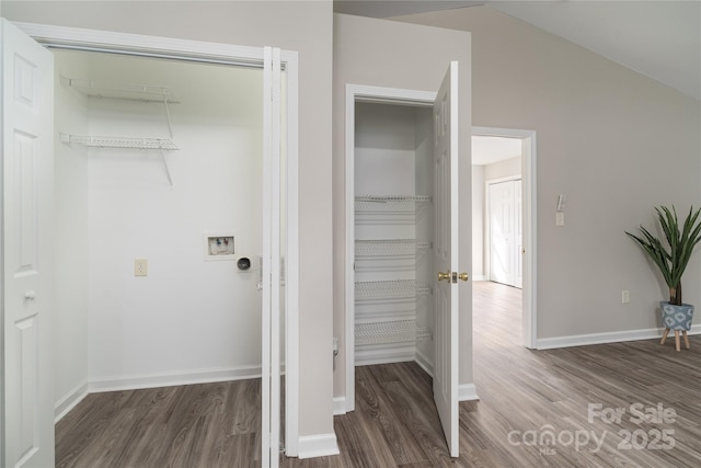 washroom featuring hookup for a washing machine and dark hardwood / wood-style floors