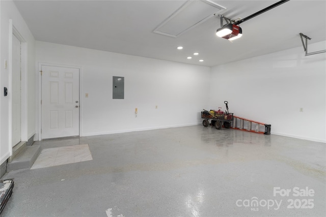 garage with a garage door opener and electric panel