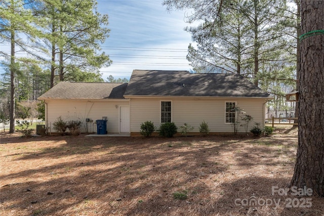 view of side of home with a lawn