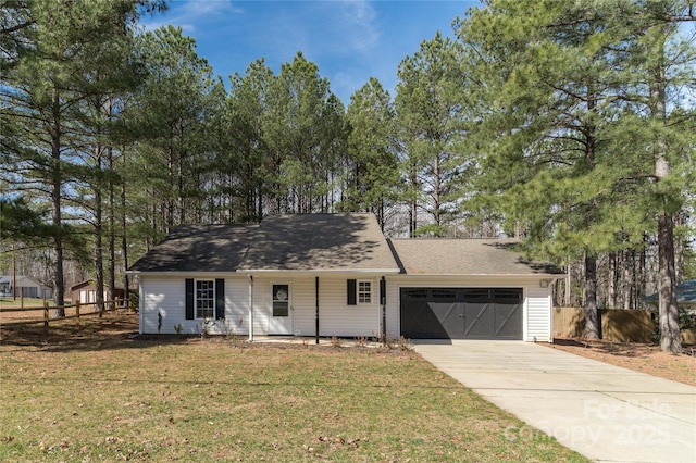 ranch-style home featuring a front lawn and a garage