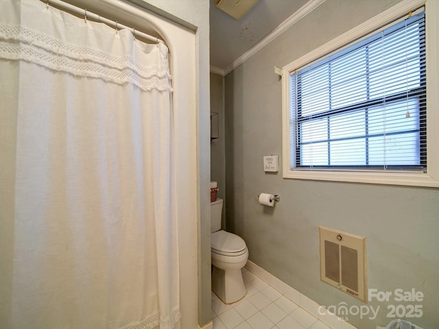 full bathroom featuring tile patterned flooring, toilet, visible vents, baseboards, and crown molding