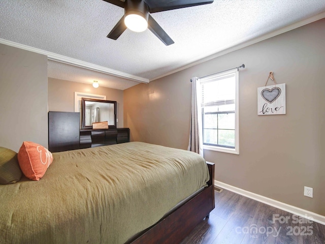 bedroom featuring a textured ceiling, a ceiling fan, baseboards, ornamental molding, and dark wood finished floors