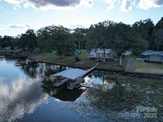 exterior space with a water view and boat lift