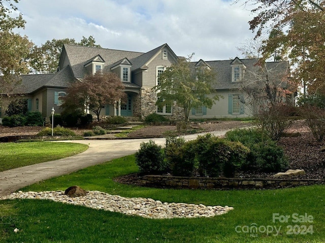 view of home's community with a lawn