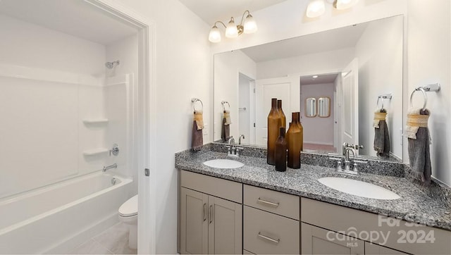 full bathroom featuring toilet, vanity, bathing tub / shower combination, and tile patterned flooring