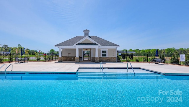 view of swimming pool featuring a gazebo and a patio area