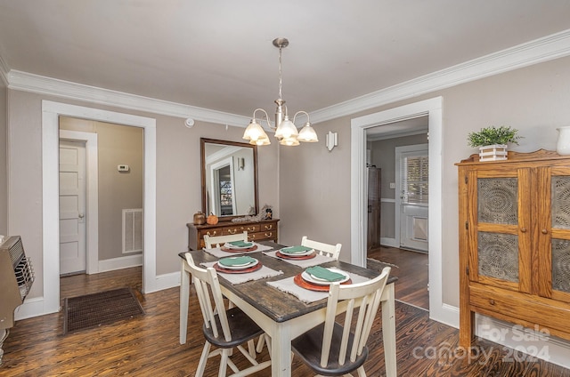 dining space with a notable chandelier, dark hardwood / wood-style floors, and crown molding