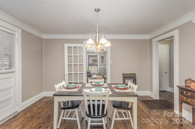 dining room with ornamental molding, a notable chandelier, dark hardwood / wood-style floors, and heating unit