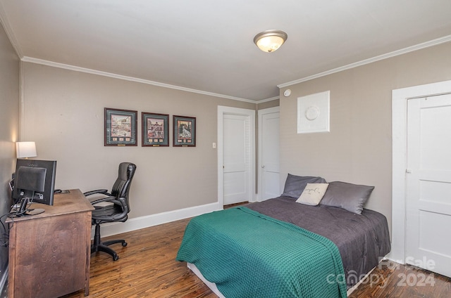 bedroom with dark wood-type flooring and crown molding