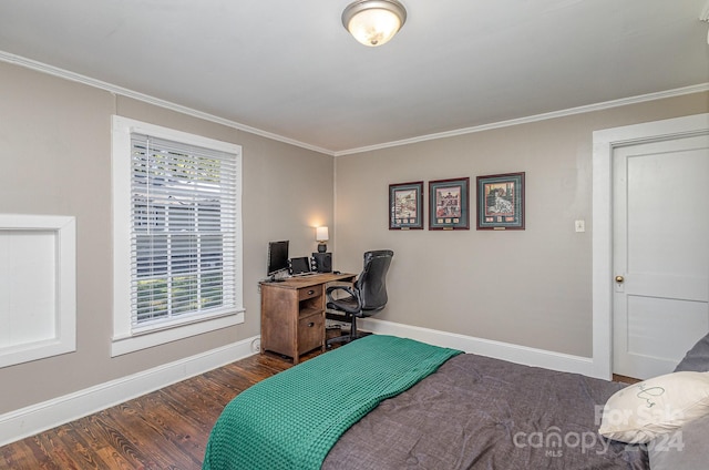 bedroom featuring dark wood-type flooring, crown molding, and multiple windows