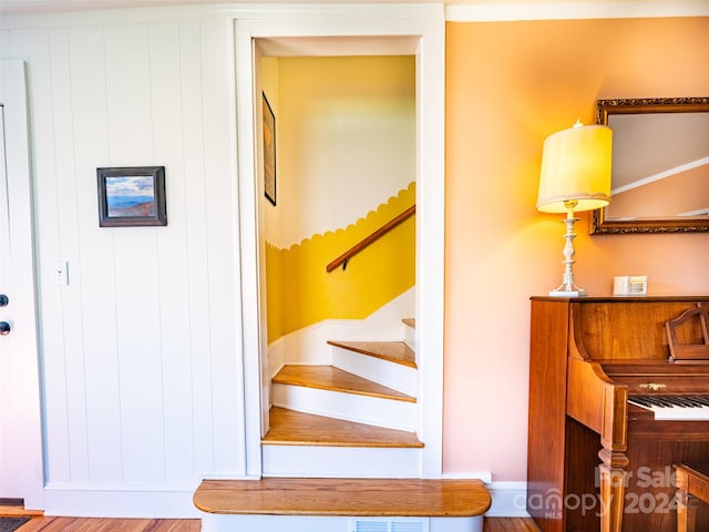 staircase featuring hardwood / wood-style flooring