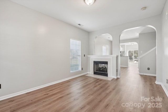 unfurnished living room featuring light hardwood / wood-style floors