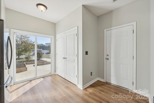 foyer with light hardwood / wood-style flooring