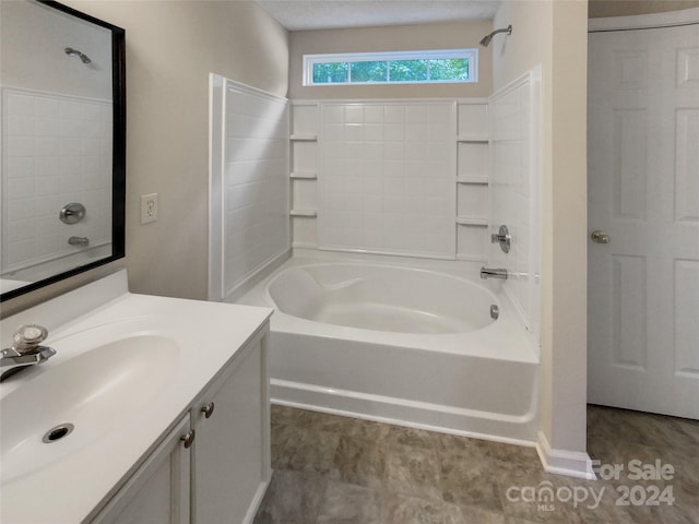 bathroom featuring vanity and bathing tub / shower combination