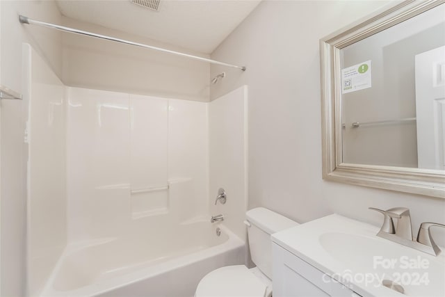 full bathroom featuring vanity, a textured ceiling, toilet, and shower / bath combination