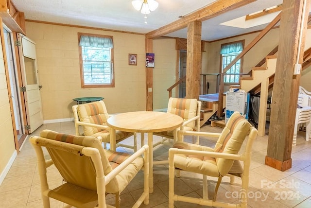 interior space featuring ornamental molding and plenty of natural light