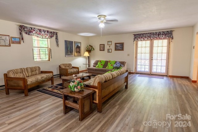 living room with french doors, ceiling fan, and wood-type flooring