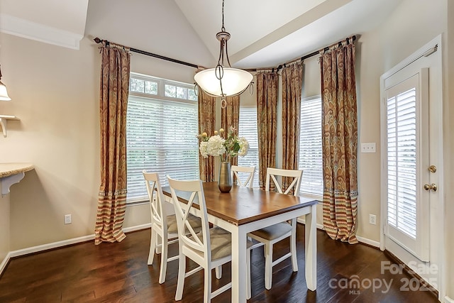 dining space with dark hardwood / wood-style floors and lofted ceiling