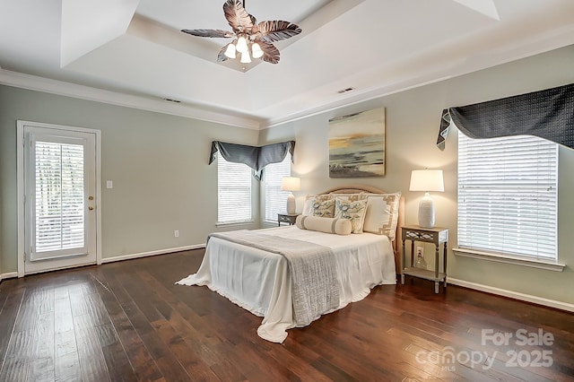 bedroom featuring a raised ceiling, ceiling fan, access to exterior, ornamental molding, and dark hardwood / wood-style flooring