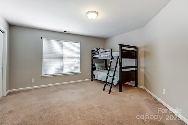 bedroom with light colored carpet