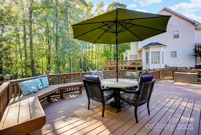 wooden deck featuring outdoor lounge area