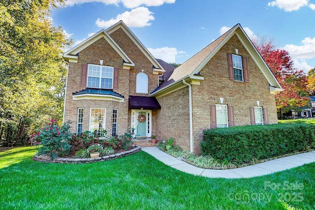 front facade with a front yard