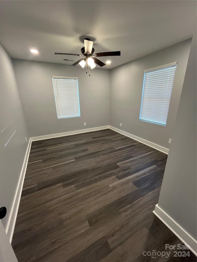 560 2nd St, Chester, SC 29706 - spare room with dark wood finished floors, a ceiling fan, recessed lighting, and baseboards