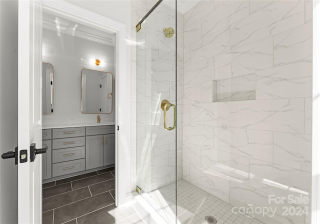 bathroom featuring vanity, tile patterned floors, and an enclosed shower