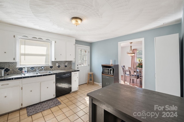 kitchen with dishwasher, tile counters, sink, white cabinets, and tasteful backsplash