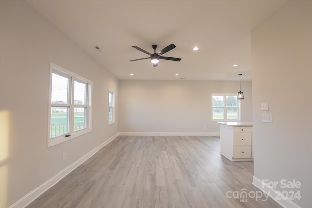 empty room featuring ceiling fan and light wood-type flooring