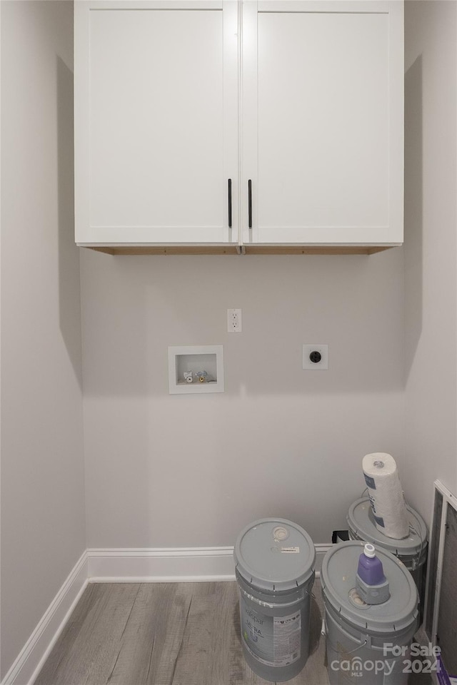 laundry area with washer hookup, light hardwood / wood-style flooring, and electric dryer hookup