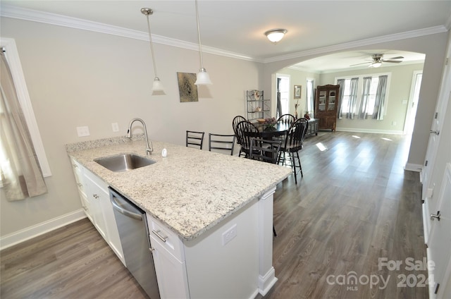 kitchen featuring kitchen peninsula, hanging light fixtures, white cabinetry, dishwasher, and sink