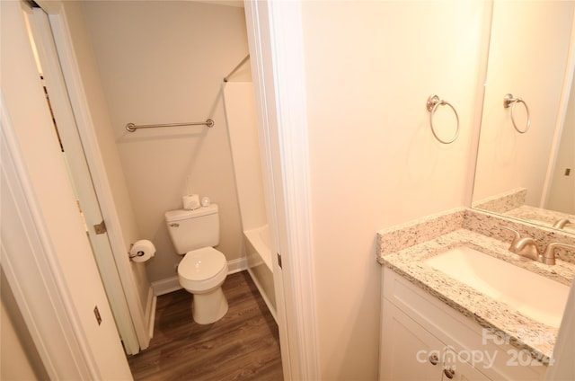 full bathroom featuring toilet, vanity, wood-type flooring, and tub / shower combination