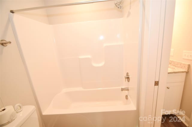 full bathroom featuring vanity, toilet, and shower / washtub combination