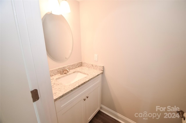 bathroom featuring vanity and wood-type flooring