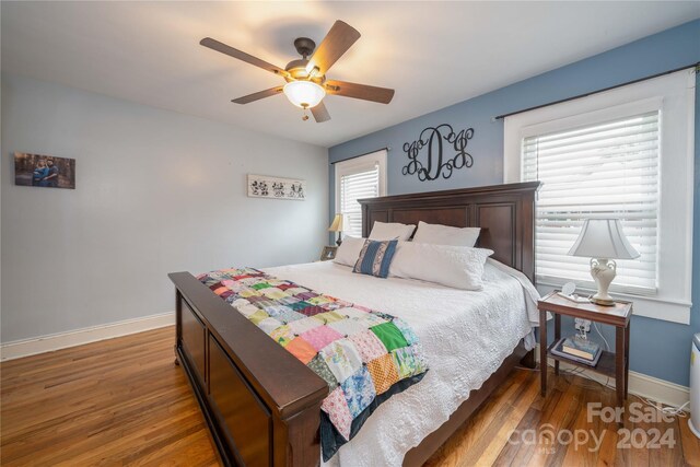416 W Main St, Mooresboro, NC 28114 - bedroom with wood finished floors, baseboards, and a ceiling fan