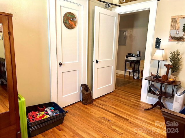 hall with light hardwood / wood-style floors