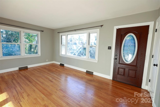 foyer entrance featuring plenty of natural light and light hardwood / wood-style floors