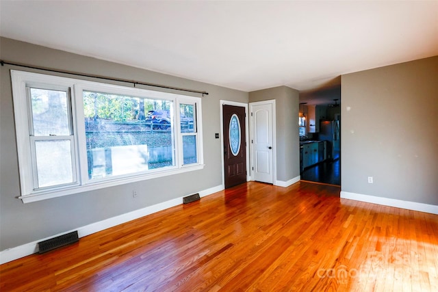 entrance foyer featuring hardwood / wood-style floors