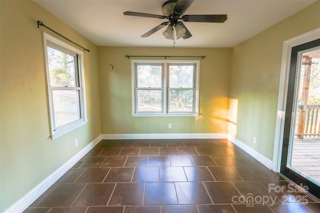 spare room with ceiling fan